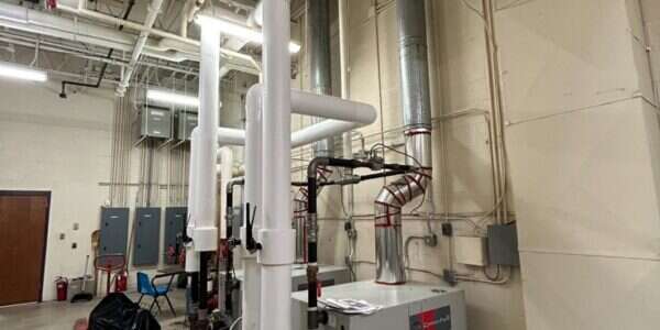 Commercial boiler and mechanical room serviced by Young's Mechanical Solutions — mechanical room, boiler