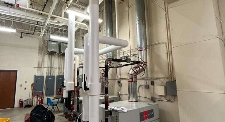 Commercial boiler and mechanical room serviced by Young's Mechanical Solutions — mechanical room, boiler