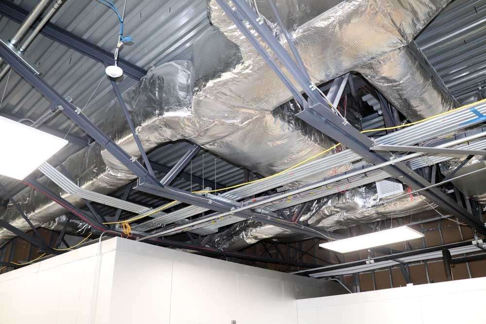 Overhead commercial ductwork and mechanical systems installed by Young's Mechanical Solutions — ductwork
