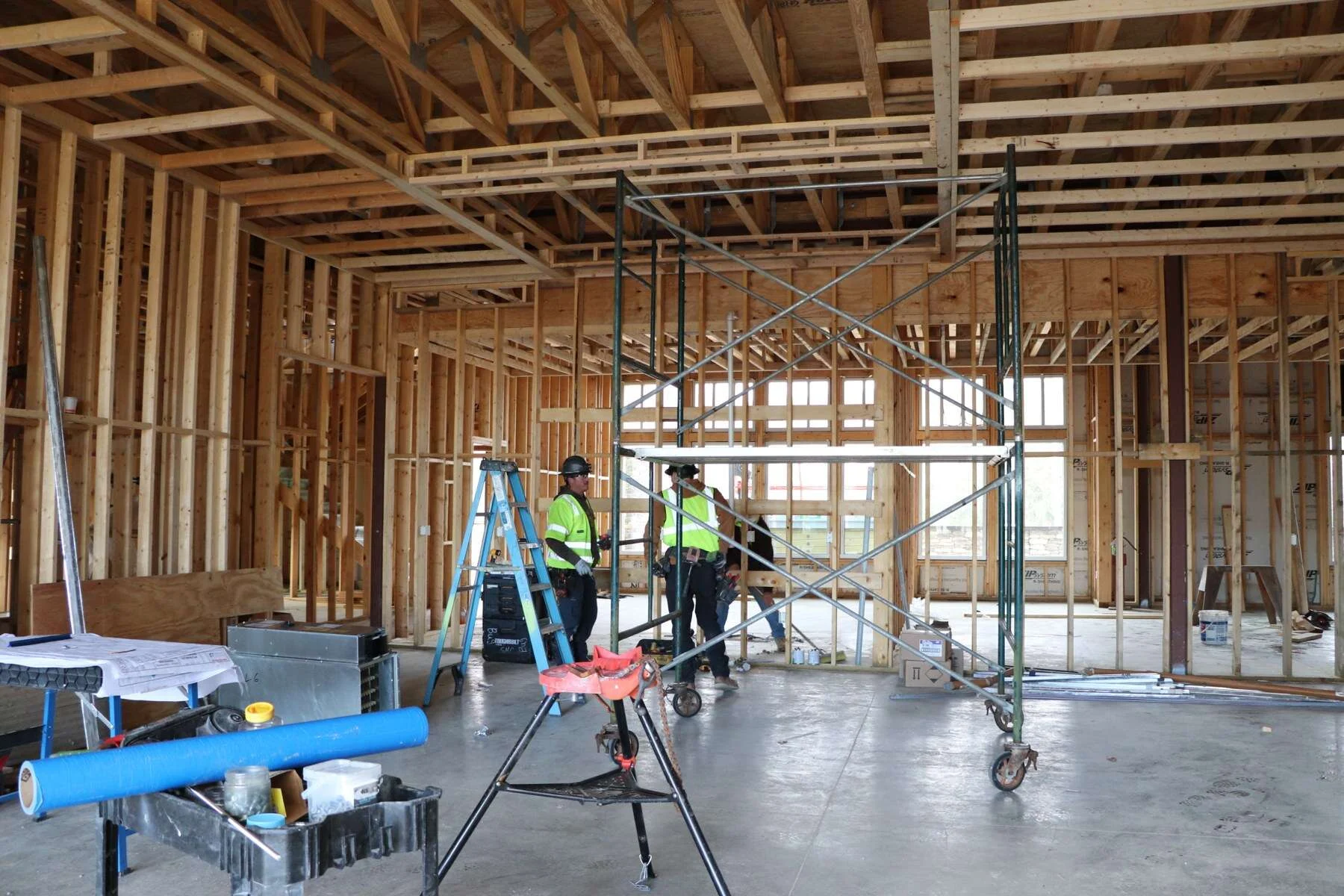 Young's Mechanical crew working inside the framed Woodstone Meadows timeshare sales center at Massanutten Resort