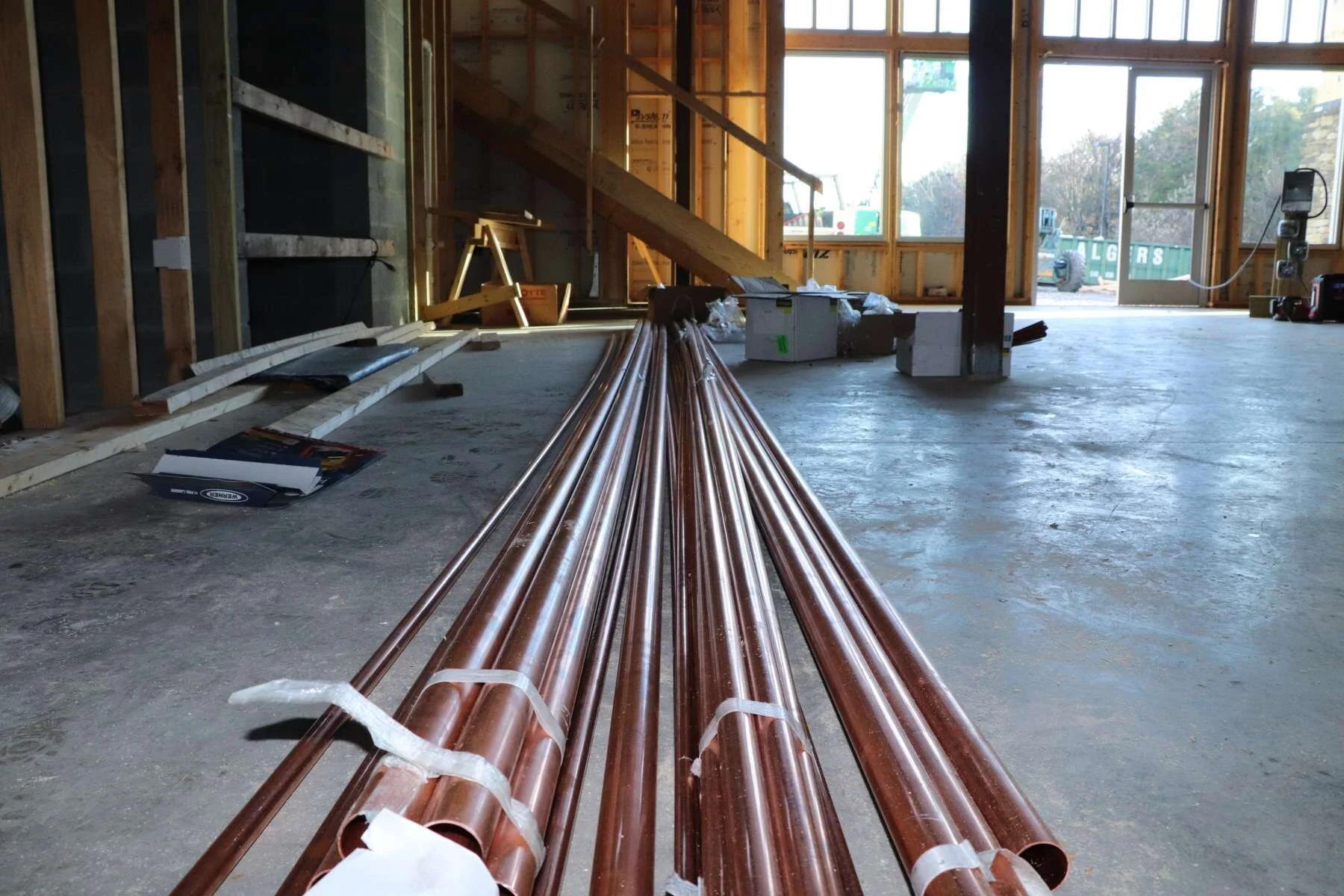 Copper pipe staged on the slab inside the Woodstone Meadows timeshare sales center at Massanutten Resort