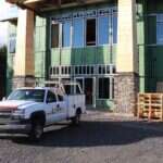 Young's Mechanical Solutions service truck parked at a commercial building under construction in the Shenandoah Valley